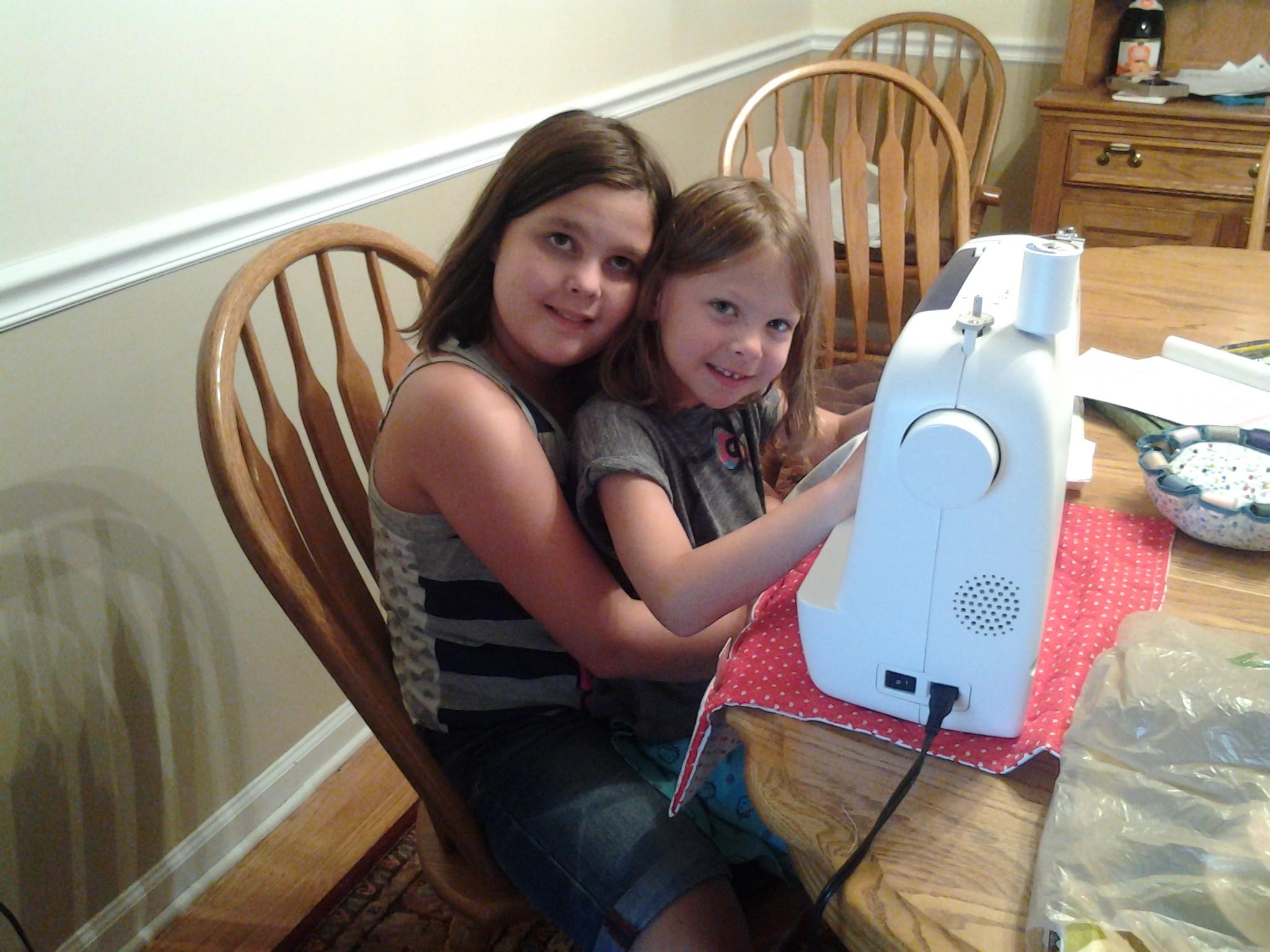 Another picture of me teaching my cousin how to sew